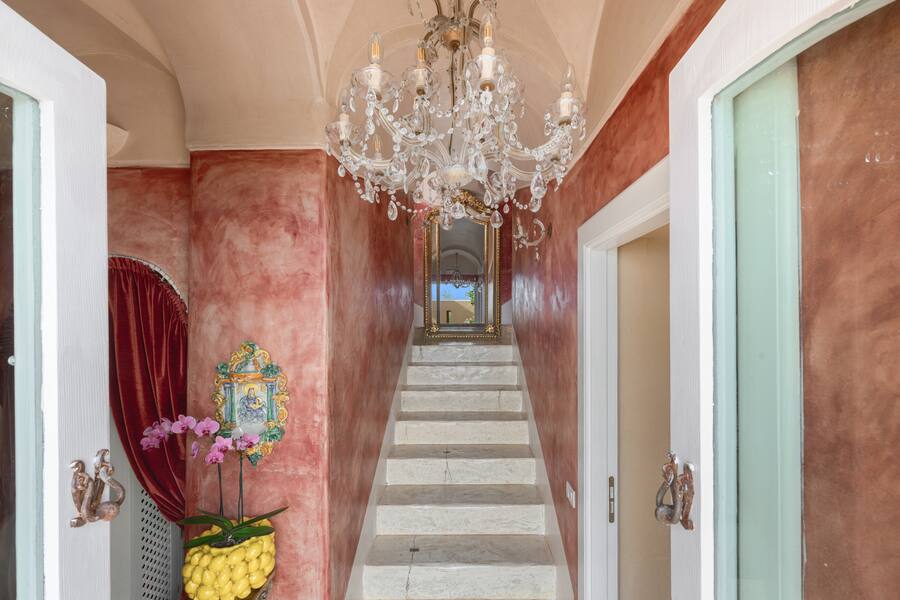 The interior staircase: original steps, hand-worked joints, unchanged since the villa's earliest days.